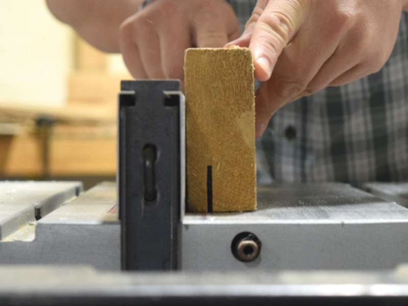 Cutting wood to determine holder block height