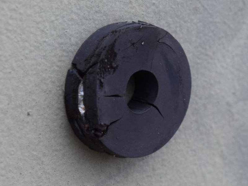 Corroded rubber ring magnet on a door outside