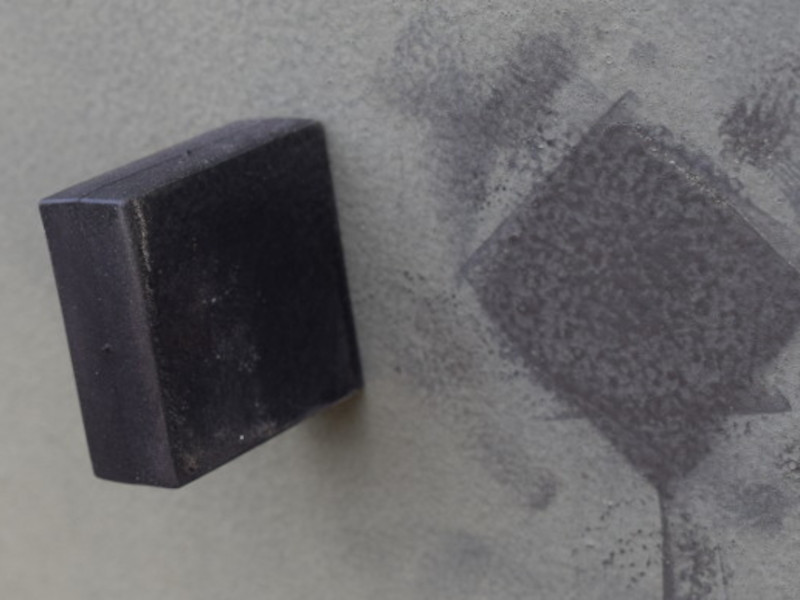 Thermoplastic rubber block magnet on a door outside