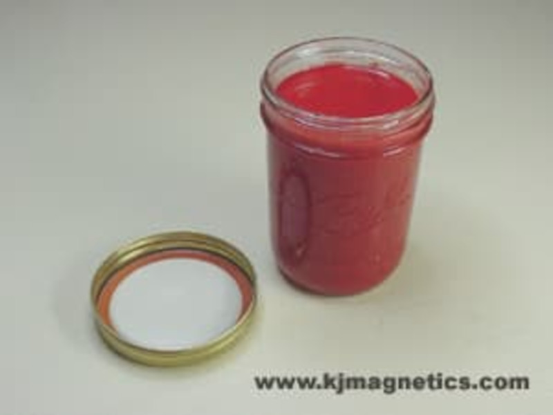Liquid rubber poured into glass jar