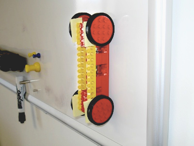 robot climbing up whiteboard