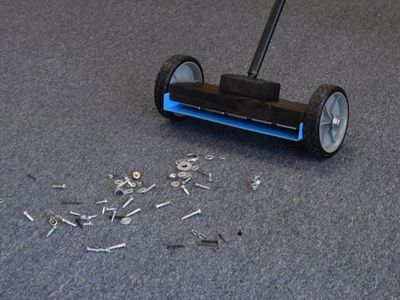 magnetic sweeper cleaning up metal scrap on floor