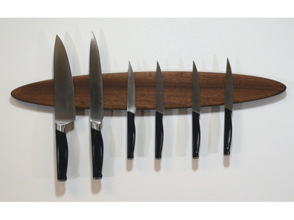 Magnetic knife holder being used in the kitchen